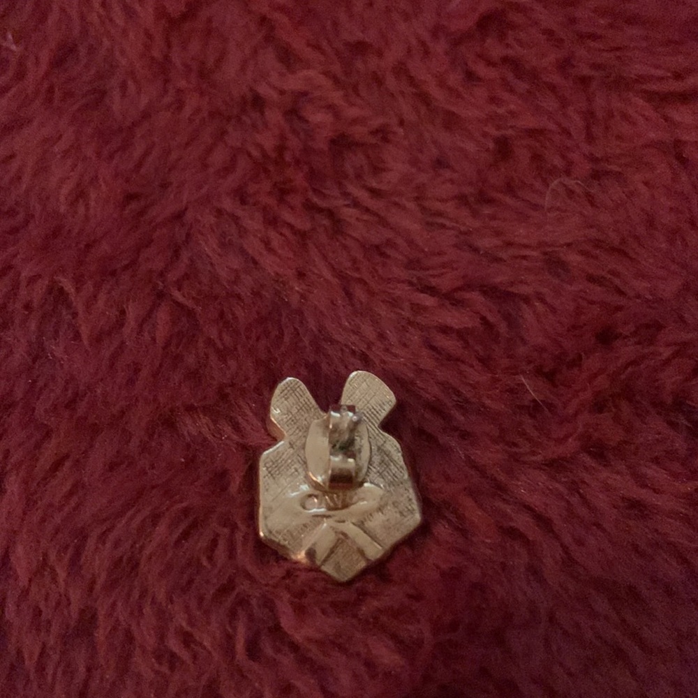A present shaped pin or brooch